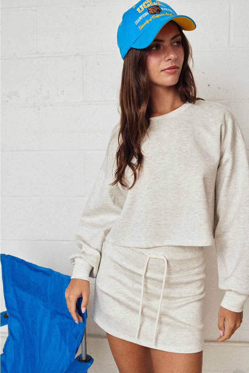 COZY SWEATSHIRT AND MINI SKIRT SET IN WHITE MELANGE