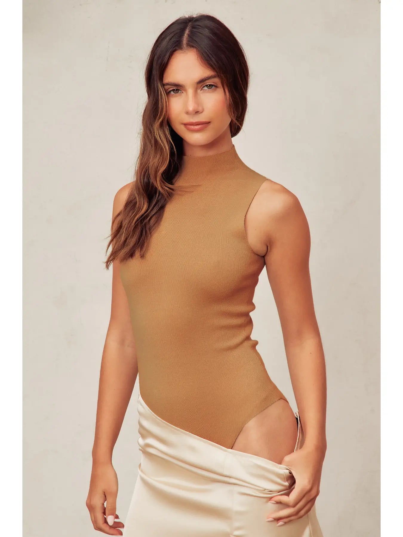 The Megan Turtleneck Tank Knitted Bodysuit in rich camel